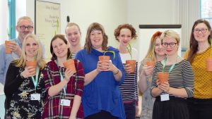 Attendees holding their potted snowdrops at the Growing Green Spaces workshop