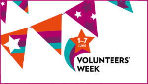 Colourful bunting and sign says Volunteers' Week
