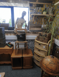 Image: recycled goods for example, a mannequin on the window sill