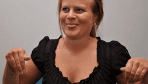 White female with fair tied back hair