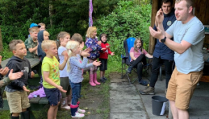 Beaver Club - group of children stood doing actions
