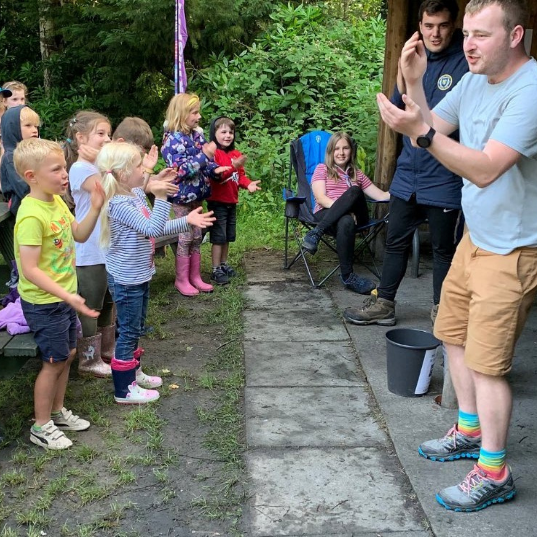 Scouts Blog Beaver Camp - group of children stood up doing actions