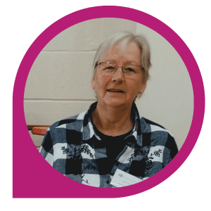 Volunteer Stories Tineka White woman with short grey hair wearing glasses