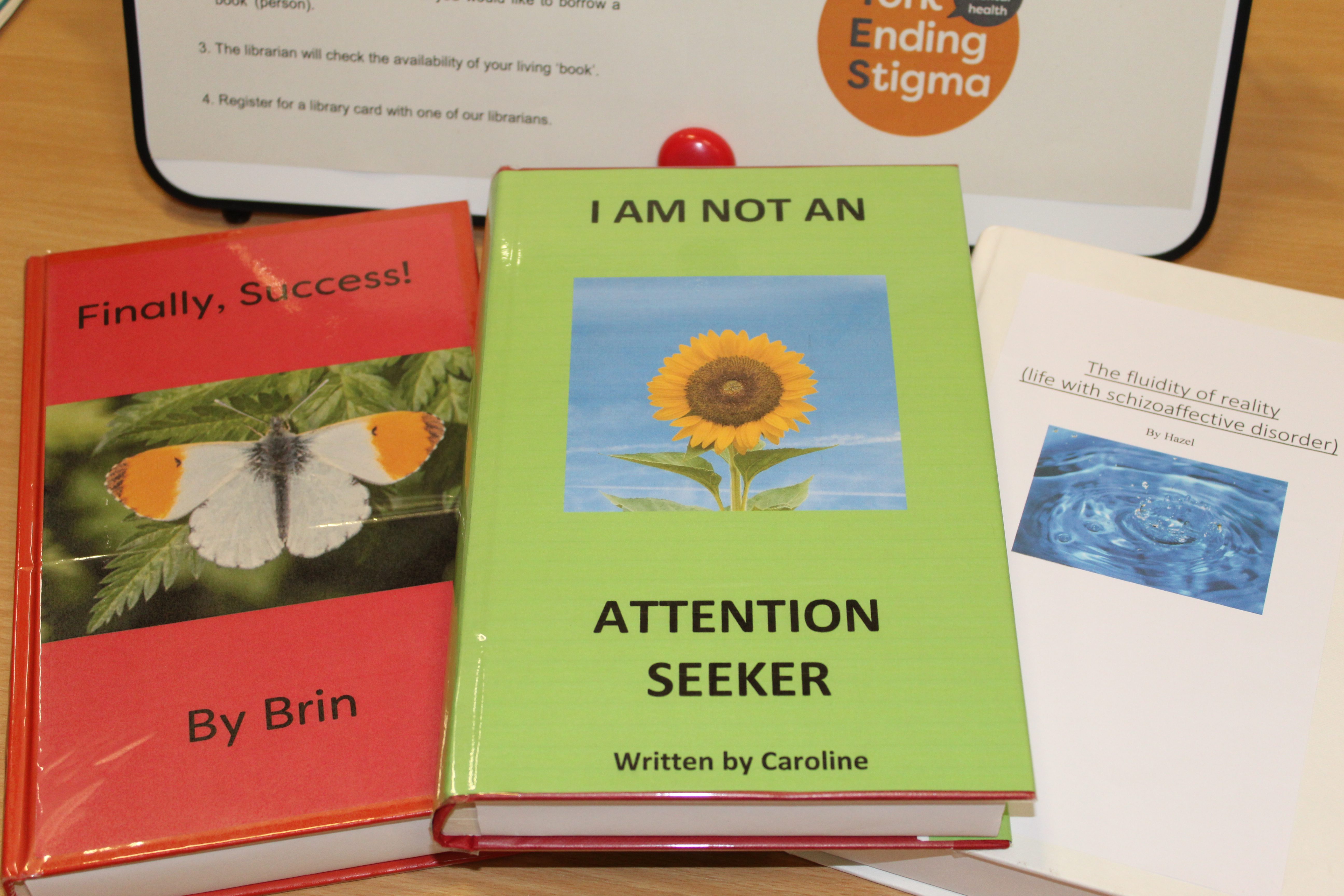 IMG_0709 Three books laid on a table and one has the title "I'm not an attention seeker".