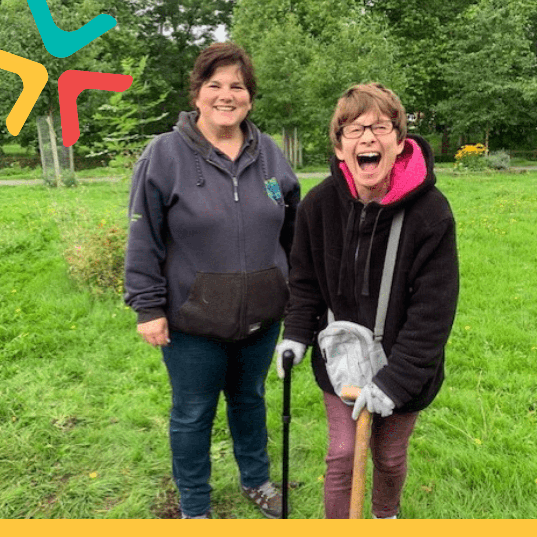 Green Social Prescribing with TCV Two people stood with gardening equipment in the middle of a field