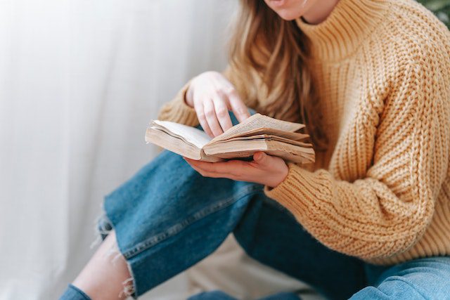 Blog Image from Pexels by George Milton Dec 2023 Image of a person sat reading a book.