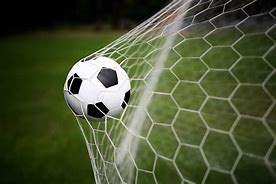 Football in net image for Bremner blog part 3 Image of a football hitting the back of a goal net.