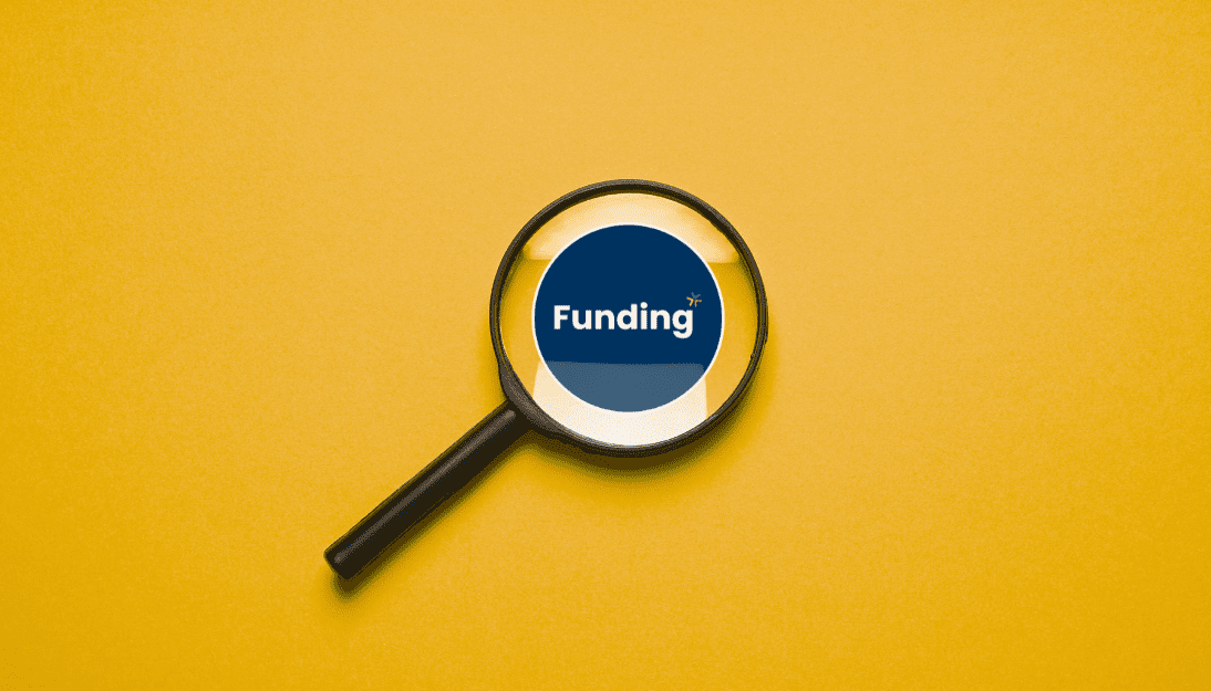 Magnifying glass on a yellow background focusing on a Funding logo.