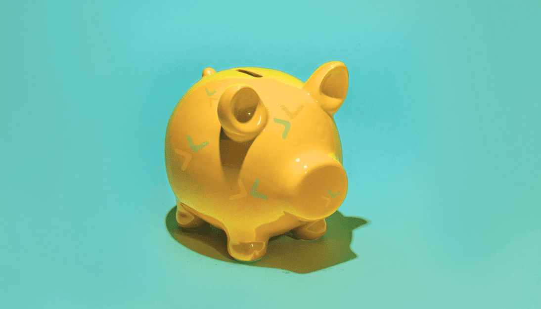 A yellow piggy bank with the York CVS logo mark subtly on the piggy bank.