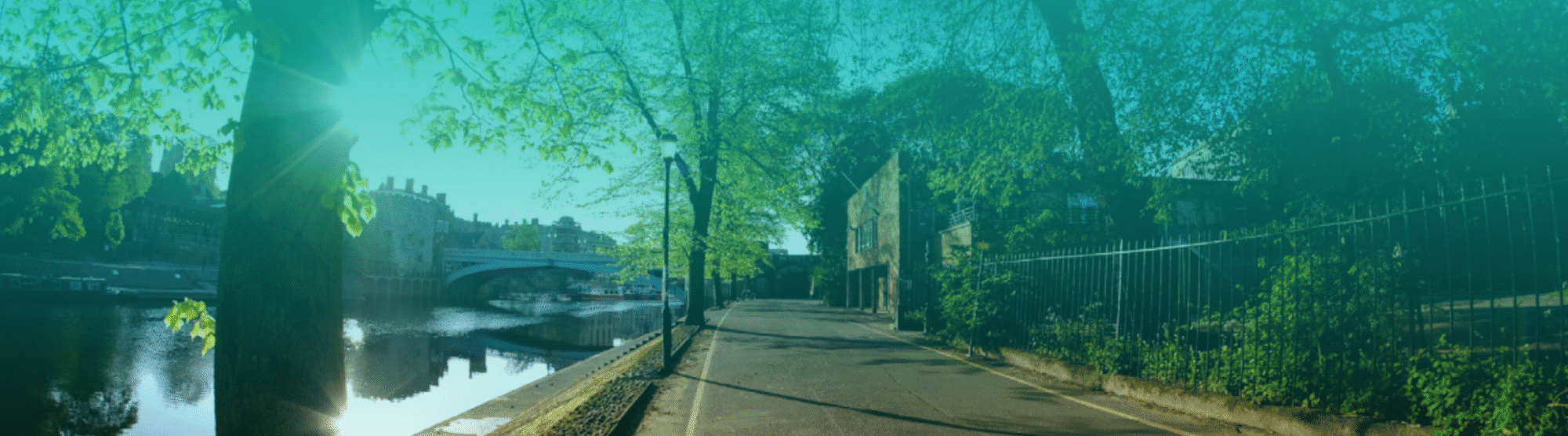 A stylised image of a road by the side of York's River Ouse and bridge in the distance.