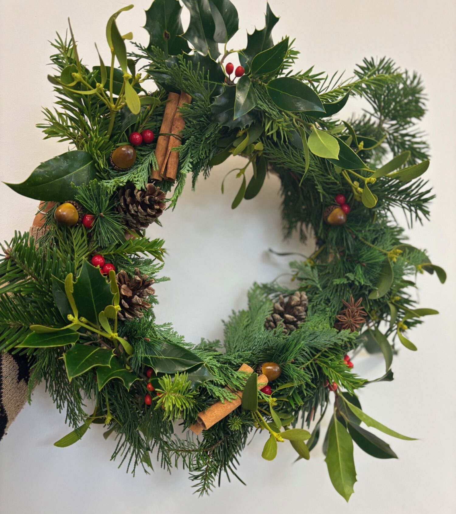 A completed festive christmas wreath.