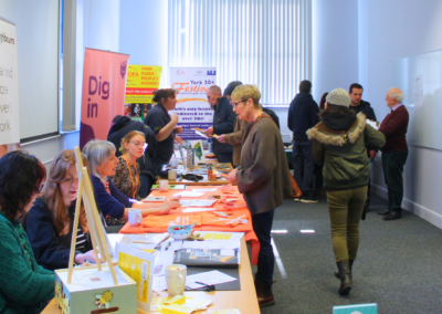 People stood talking to stall holders